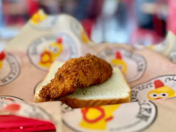 The single tender cost $4.69. It comes with a slice of soft white bread, a traditional presentation at hot chicken joints in Nashville.