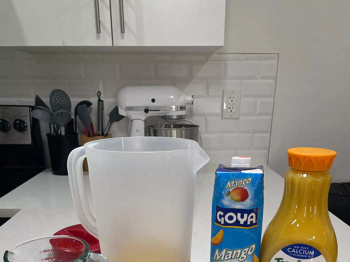 Next, add juice to the pitcher.