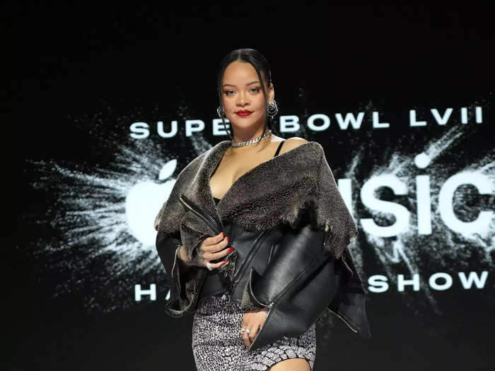 Rihanna arrived at a press conference ahead of the Super Bowl in a crocodile-print dress in February 2023.