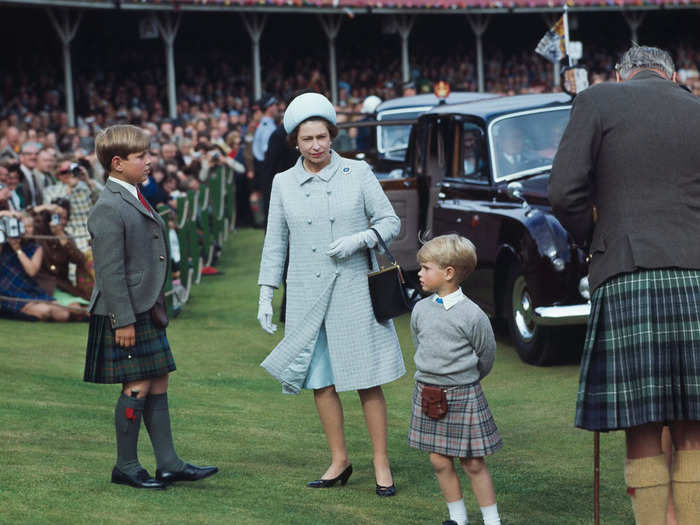 Queen Elizabeth II wore a pale blue coat dress with a matching hat to the Braemar Highland Gathering in 1969.