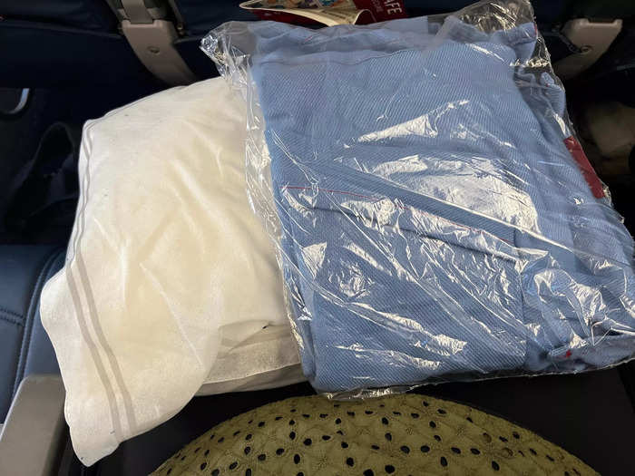 As someone who travels internationally at least once a month, I know to expect some sort of pillow and blanket combo in economy on mainline carriers.