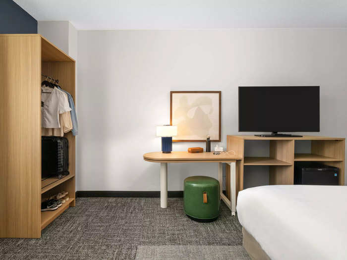 Despite being a budget brand, Spark hotel rooms will still have plenty of amenities like a refrigerator, adjustable desk, and open closet.