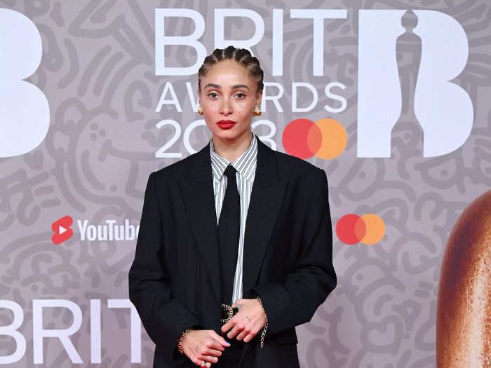 Model and actor Adwoa Aboah wore an oversized suit jacket, black pants, a collared shirt, and a tie. The outfit lacked any memorable quality.