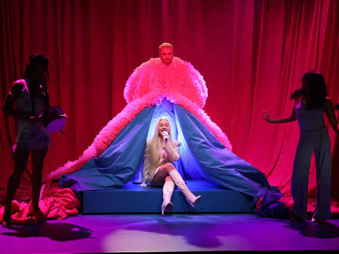 For their SNL performance the same month, Smith was joined by Kim Petras in a hot pink ruffled gown with oversized poofs and a train that could fit Petras inside.