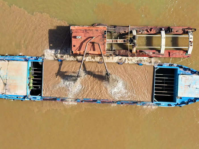 Large barges are dredging up tons of sand from the river to supply concrete for developing Southeast Asian cities. The sand is exported to places like Singapore, where nearly 50 square miles of land have been added on waterfronts, and Phnom Penh, the capital of Cambodia.