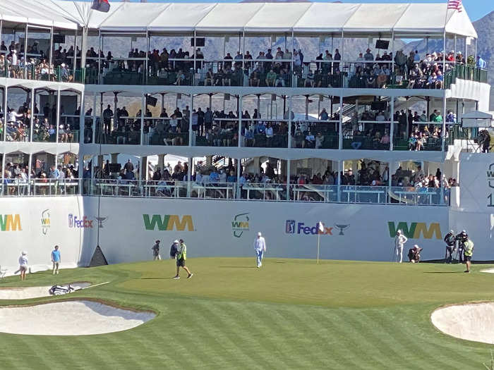 This angle gives a great perspective of how close the fans must feel to the players on the green.