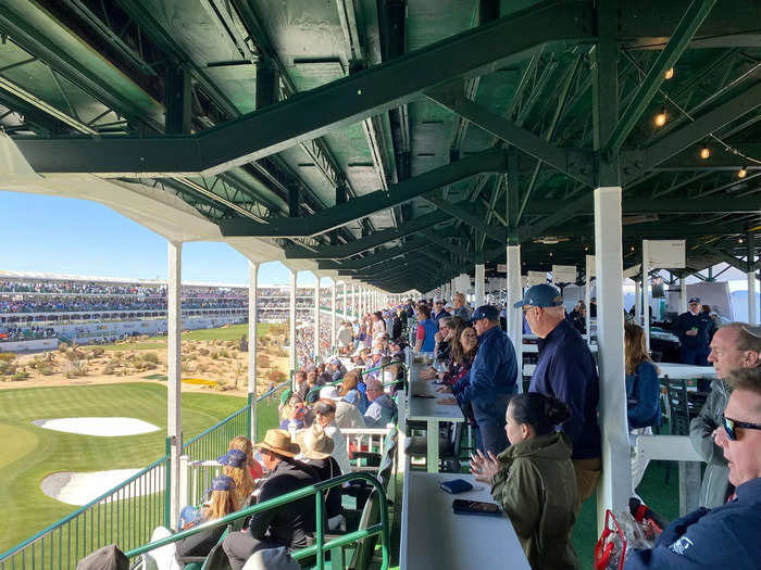 The stadium hole is split into different seating sections. The majority of the hole is surrounded by a three-story club complex.