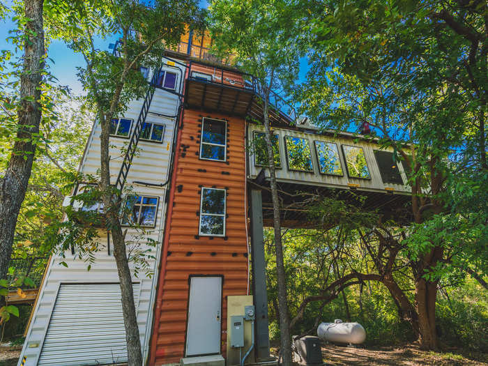 The shipping container treehouse has six floors, with two bedrooms and one bathroom. The structure took slightly over a year and a half to complete.