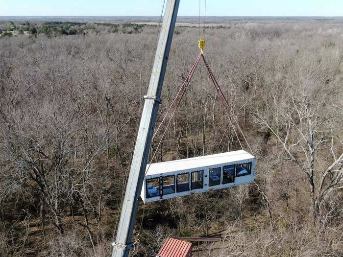 The four shipping containers had to be arranged into position with the help of cranes.