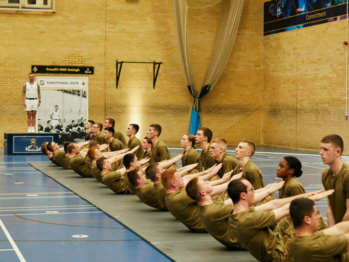 "Down, up, down, up," the PT shouts, as  the recruits move to his orders.