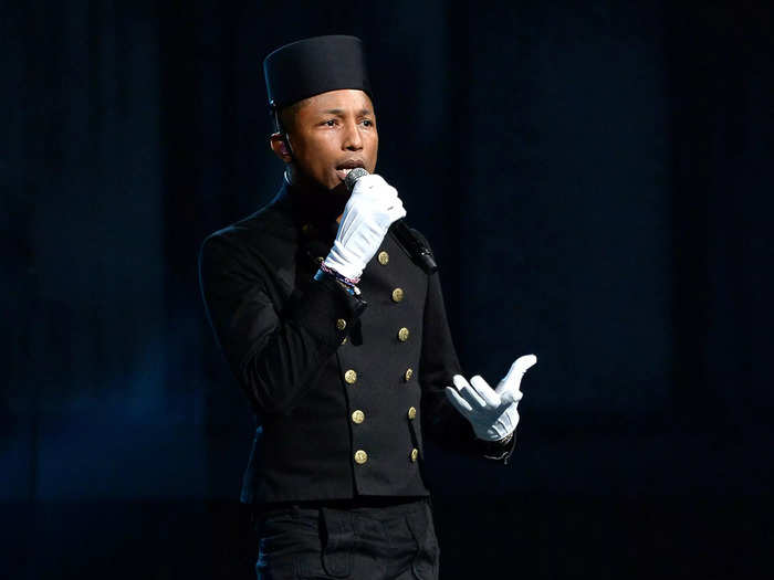 During his performance, Williams wore a chic bellboy look with canary-yellow shoes.