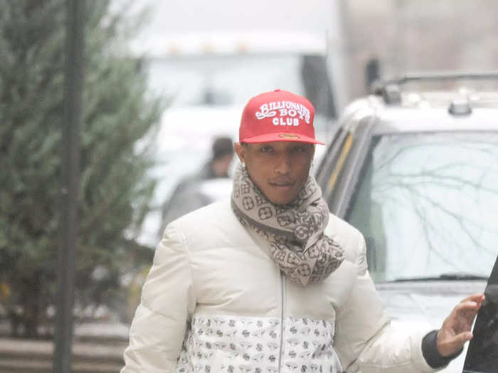 Pharrell Williams was spotted out and about in New York City accessorizing a casual ensemble with a bold snakeskin Hermès Birkin bag.