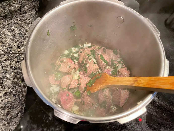 Then add the chopped onion, parsley, and garlic.