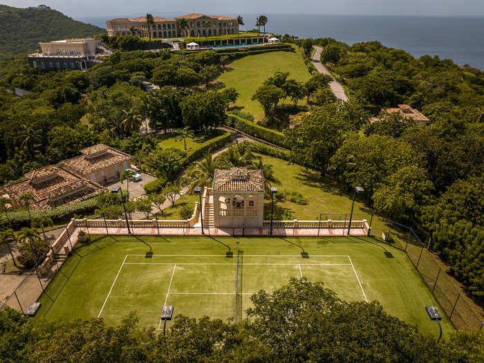 The estate also has a pool bar, an outdoor fountain, gardens, and tennis courts.