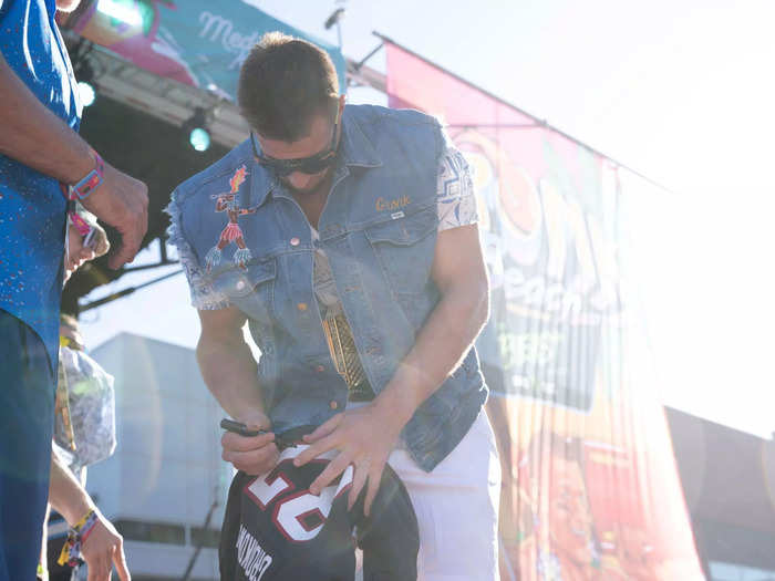 Gronk also took time to sign items on stage.