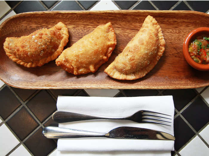 Bite into a golden-brown, crispy empanada, Chile