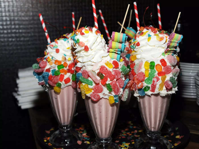 For the ultimate indulgence, dive into a milkshake from Black Tap Craft Burgers & Beer in New York City, an eatery known for its extravagant, candy-loaded shakes.