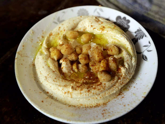 Dip a piece of warm, fluffy pita into hummus, the Middle-Eastern dip made of chickpeas, oils, and tahini.