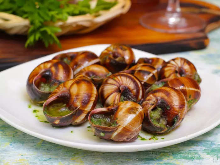 Adventurous eaters should try escargot, the traditional French snail dish.