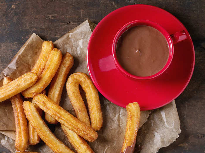 For dessert, enjoy a Spanish favorite — crispy churros dipped in warm chocolate sauce.