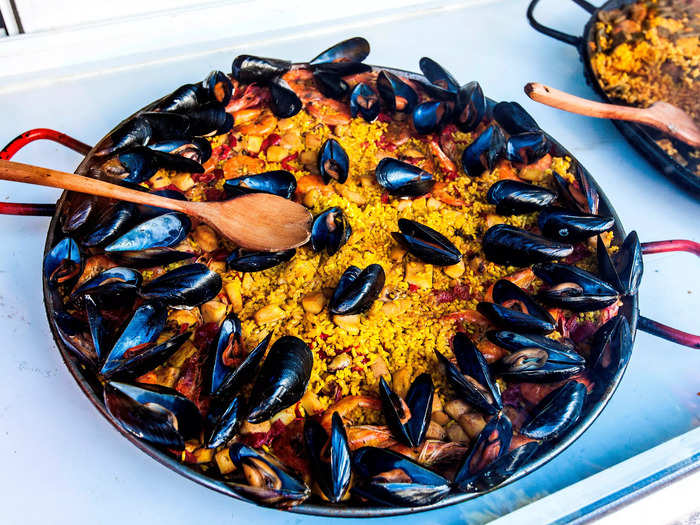 You might need more than one person to help you finish paella, another traditional Spanish dish of rice, seafood, and vegetables — all cooked and served in a giant skillet.