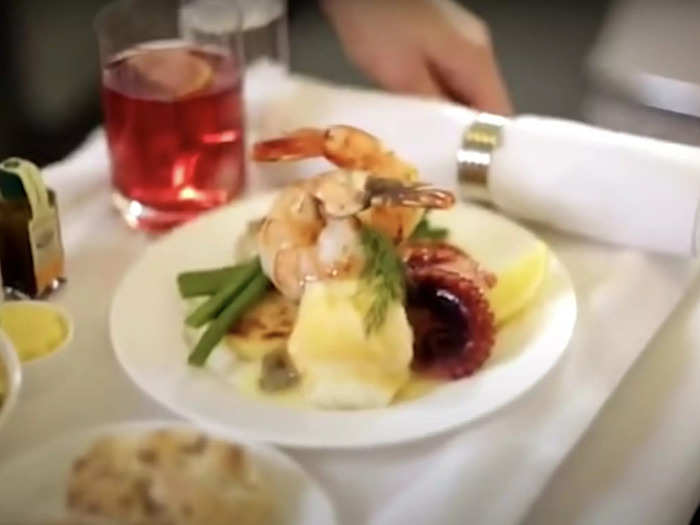 The meals are placed on trays and then onto the trolleys which are eventually transported to the aircraft and served to the passengers aboard.