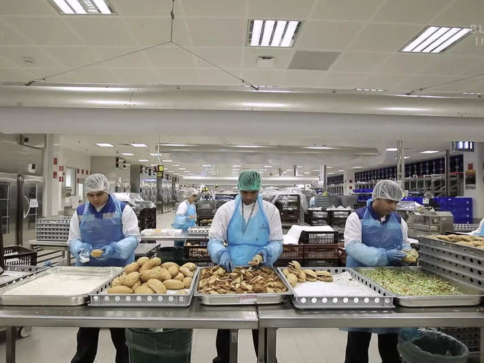 Staff in the cold kitchen, located on the upstairs level, preps and plates the appetizers and sandwiches.