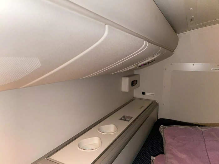 In the bedroom nooks, I noticed that pilots had more amenities. Near their beds, for instance, there were multiple cup holders and overhead storage.