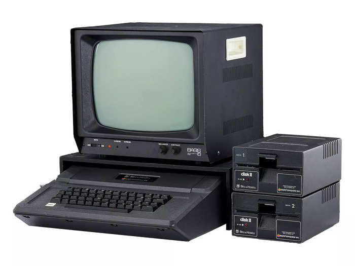 The 1979 Bell and Howell Apple II Plus Series Computer is estimated to sell for between $500 and $700. It is pictured here with two Bell & Howell Apple II drives, and a "Green Phosphor" third party Apple monitor from 1980.