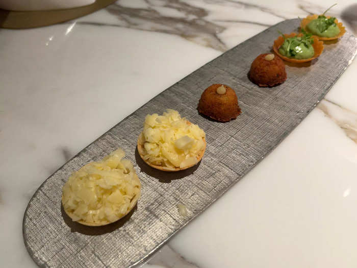 The meal began with an amuse-bouche featuring several small bites.