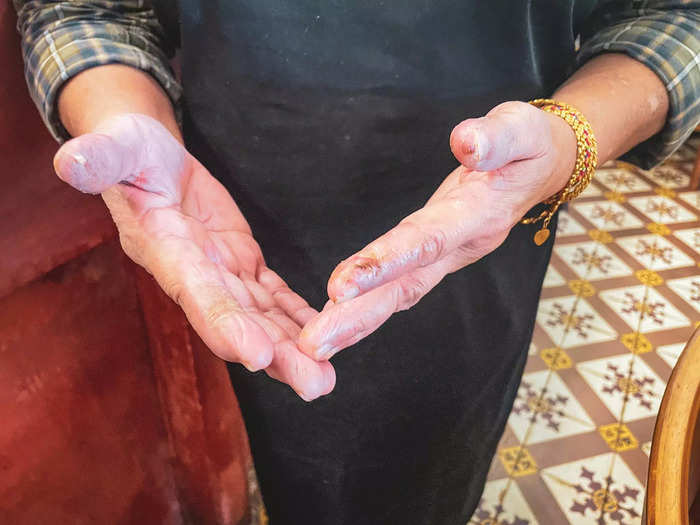 Lean Gaik still makes most of the food by hand with her staff. I noticed the calluses on her hands, marks that show decades of hard work.