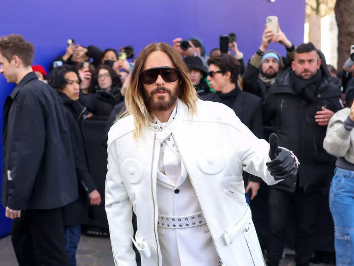 Jared Leto also opted for a black-and-white look, but he paired his ensemble with leather gloves and wide lens sunglasses.