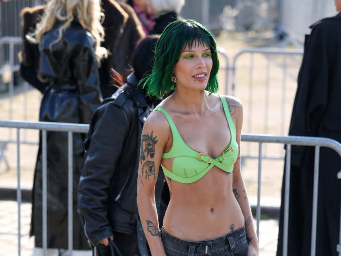 Halsey wore low-rise denim shorts with a green bralette that matched her hair and makeup.