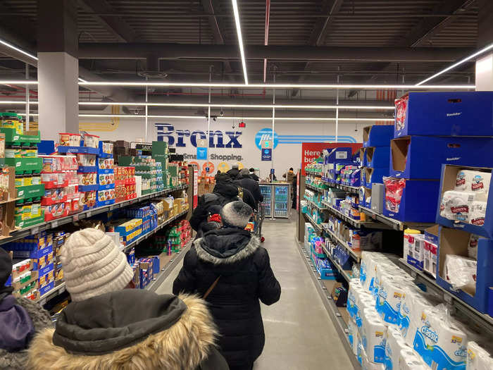 The checkout line at Aldi in the US stretched all the way down the paper-goods aisle.