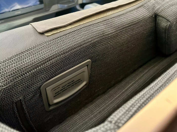 The pillows and blankets are stored in the space behind the lounger, so they are out of the way. The smaller pillow found on the seat during boarding can also fit there.