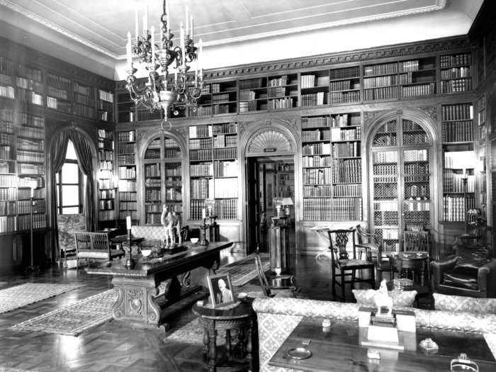 Their library was filled with 8,000 volumes, including original books by Audubon and Shakespeare. It had a chandelier and a table with candelabras.