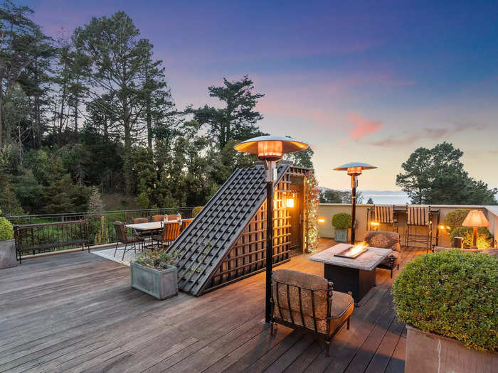 Like the rest of the house, the rooftop terrace has a golden feel as the sun sets over San Francisco.