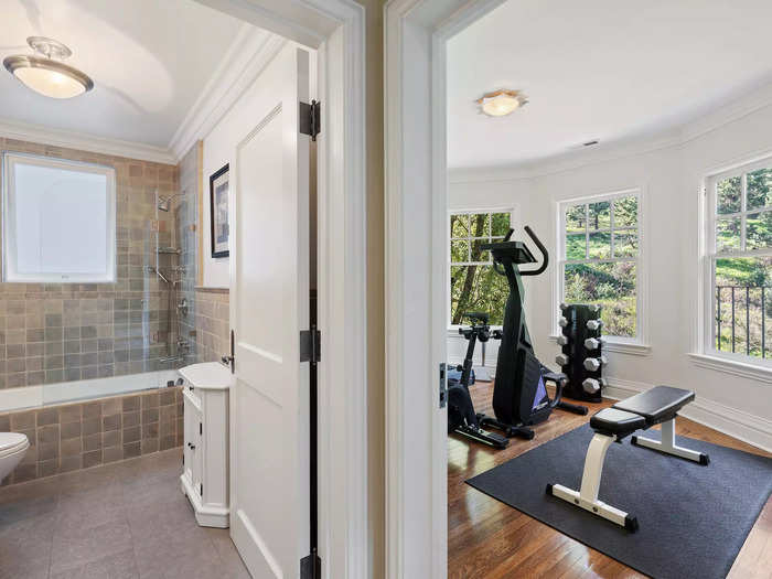 A third bedroom on this floor is being used as a gym. It neighbors a full bathroom.