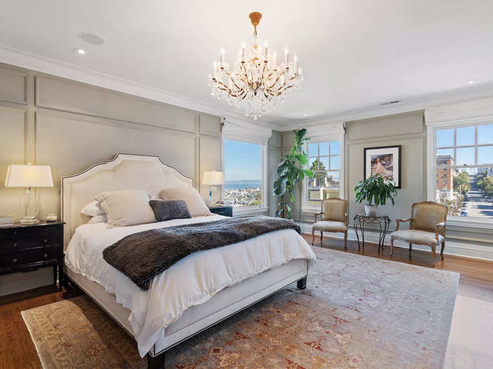 The primary bedroom overlooks the San Francisco Bay. It