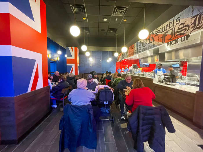 Inside, the eatery is decked out in a United Kingdom theme with the flag printed on the walls and a red, white, and blue color scheme.