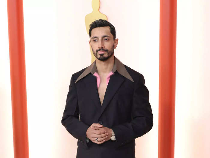 Riz Ahmed used an unbuttoned shirt to create a plunging neckline effect.