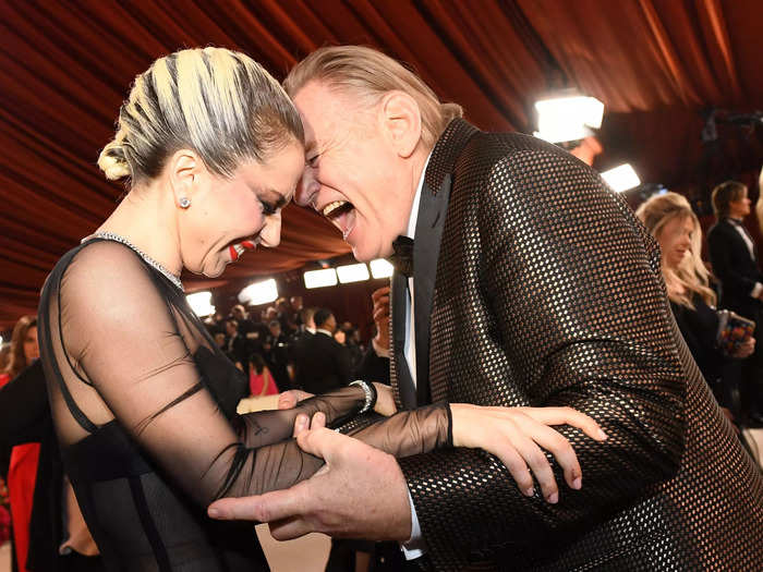 Lady Gaga and "Banshees of Inisherin" star Brendan Gleeson were seen cracking each other up as they shared a moment on the carpet.