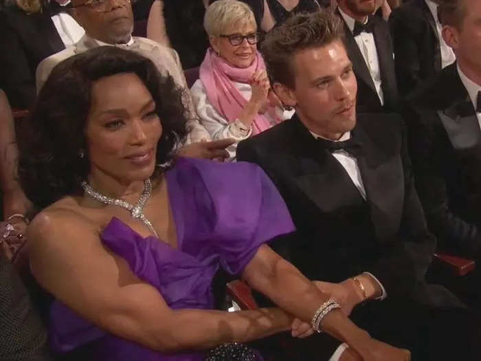 Angela Bassett and Austin Butler, who both missed out on their respective awards, were seen supporting each other by holding hands in the audience.