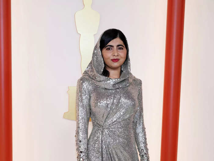 Malala Yousafzai attended the Oscars in a shimmering silver Ralph Lauren gown that included a built-in headscarf.