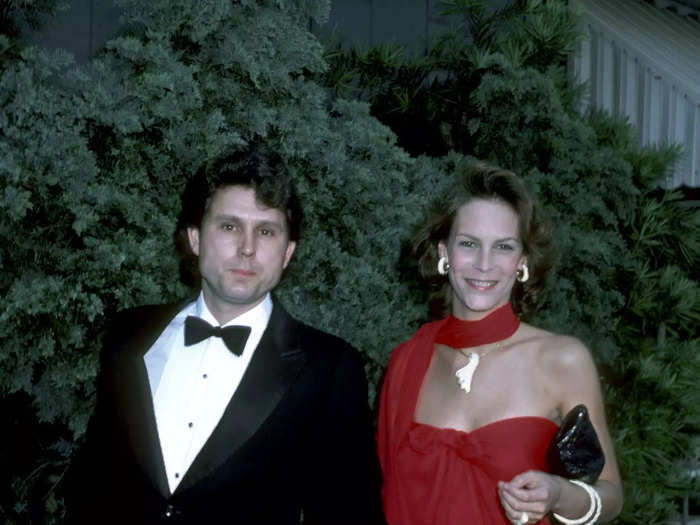 For her first Academy Awards in 1974, Jamie Lee Curtis wore a red midi dress and matching scarf.