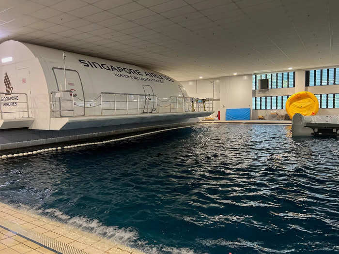 A mock aircraft is attached to the pool, and trainees are required to jump off the ledge — a five-foot drop — and swim to the other side. This demonstrates their swimming skills and ability to overcome heights.