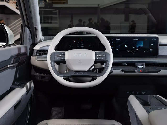 On a panel behind the steering wheel, it features two 12.3-inch displays plus a five-inch touchscreen between them that controls the climate settings.