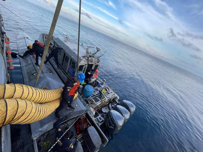 Upon investigation of the submarine, Colombian navy officials discovered two dead bodies aboard as well as two men in "poor health" due to toxic fume inhalation from the submarine