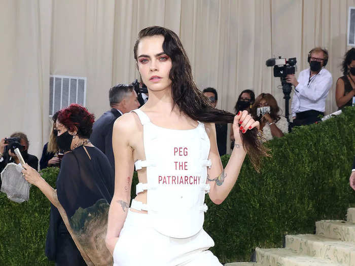 In one of her boldest looks yet, Delevingne wore a white fencing vest (and nothing underneath) with the phrase "Peg the patriarchy" to the 2021 Met Gala.