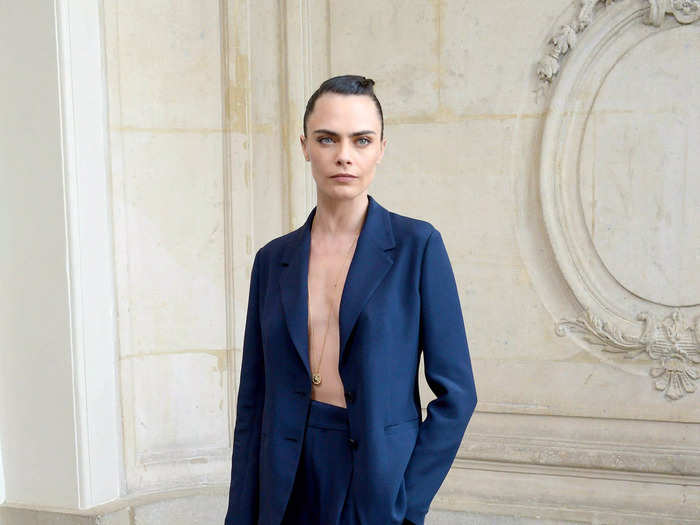 She skipped a shirt at a Paris Fashion Week show in July 2021, simply wearing a navy-blue suit with an open jacket.